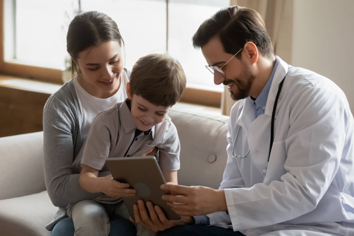 Doctor and mother teaching kids about their allergies