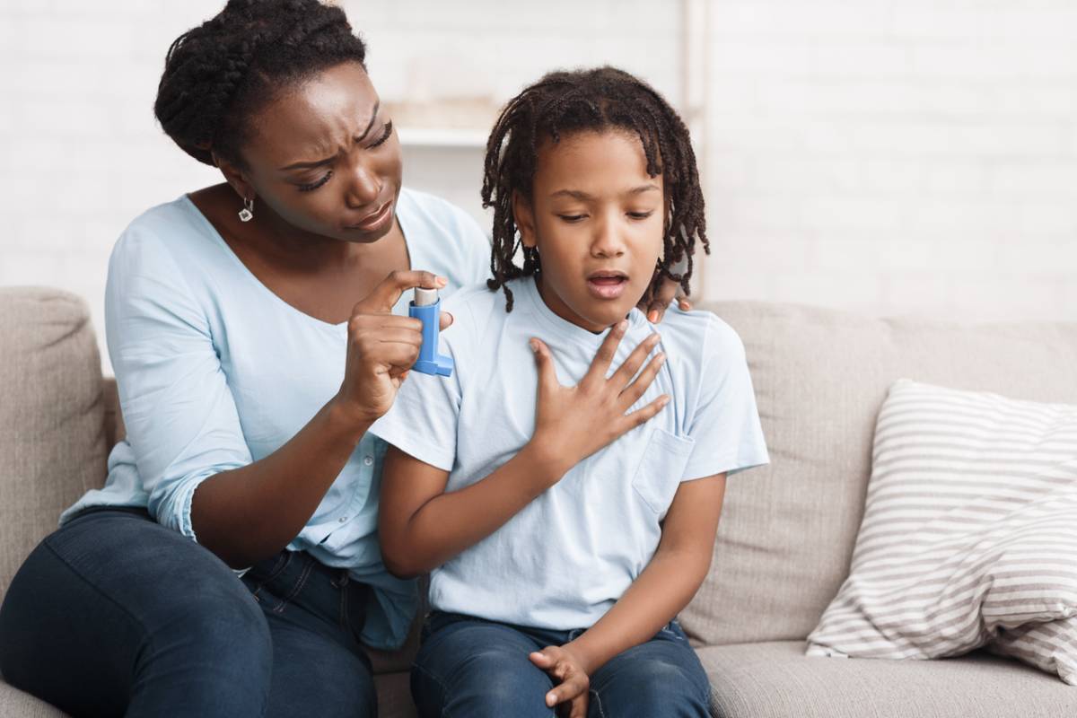Mother with child showing early signs of asthma in kids