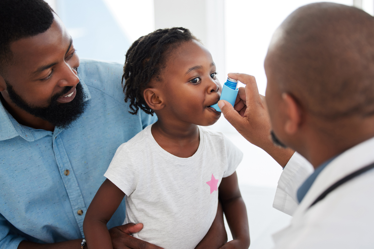 The image shows a child and doctor together using an inhaler. It attempts to explain why asthma can develop in different people.
